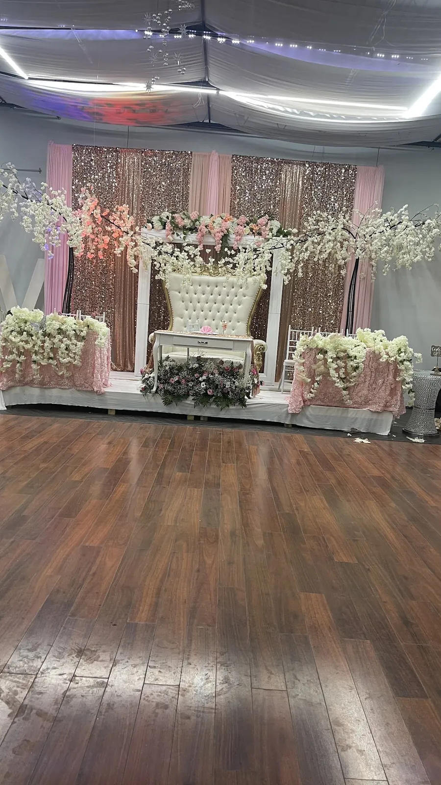 Blush floral stage with a tufted throne
