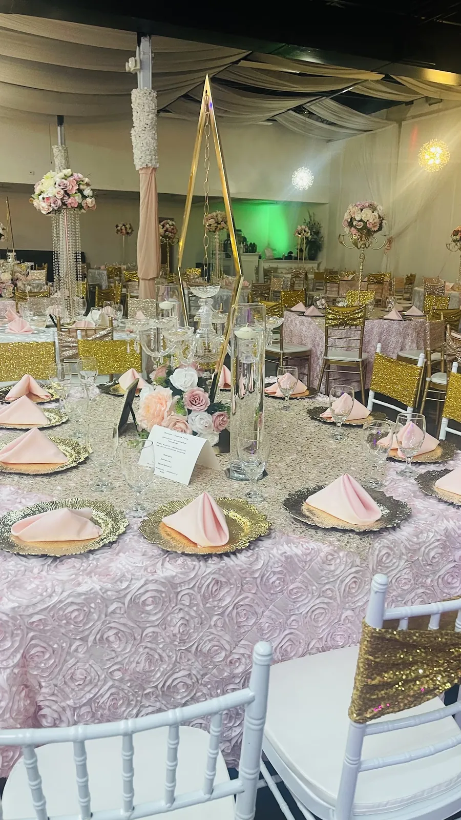 Blush napkins and gold chargers on a sequin tablescape